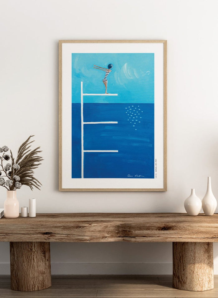 Ready to Dive by Awol Art Alex is a playful modern art print featuring a striped swimmer, tall diving board, vivid blue water, and retro summer style.