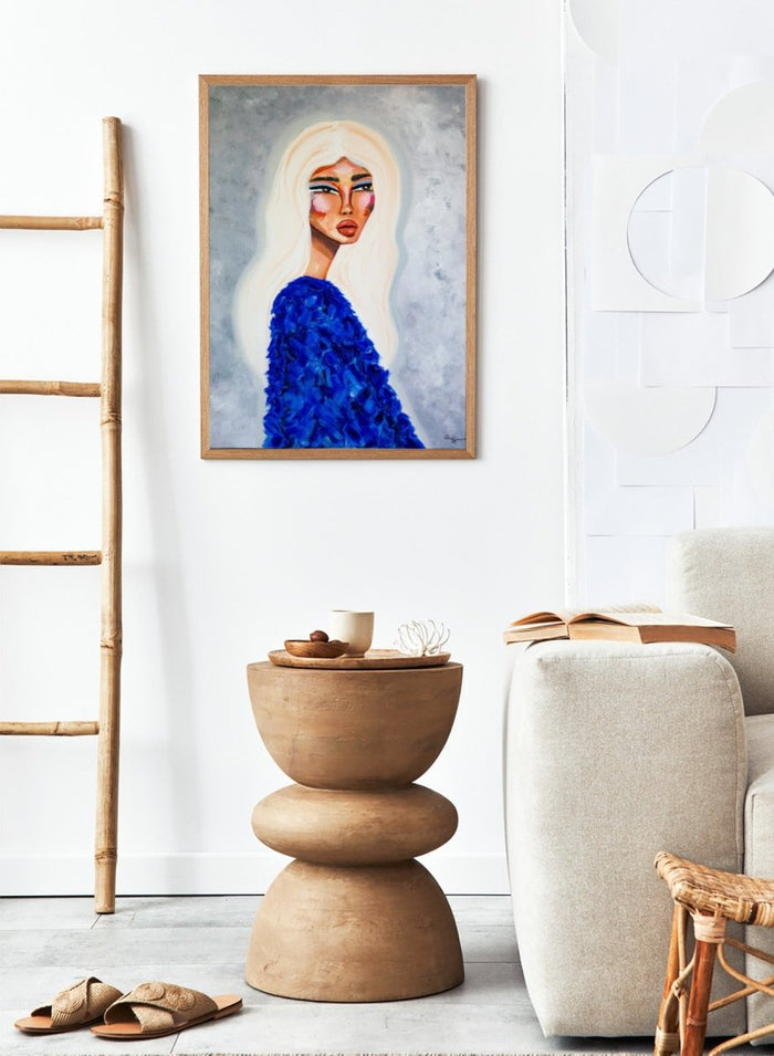 Artistic depiction of a woman with long blonde hair wearing a blue textured garment against a gray background. Elegant Blue Fashion by Amy Straley is a contemporary figurative art print featuring a feminine portrait, bold blue tones, and expressive modern artwork.