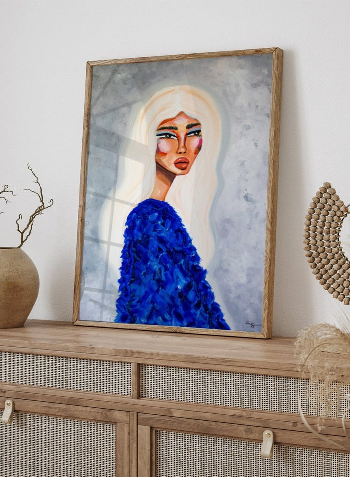 Artistic depiction of a woman with long blonde hair wearing a blue textured garment against a gray background. Elegant Blue Fashion by Amy Straley is a contemporary figurative art print featuring a feminine portrait, bold blue tones, and expressive modern artwork.