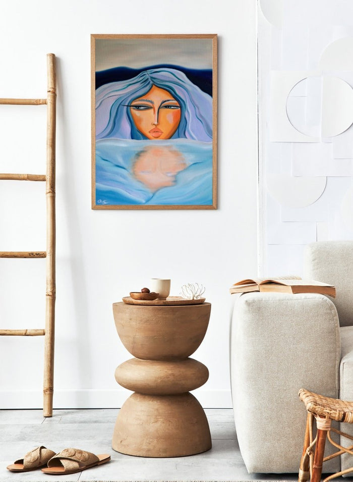 Artistic depiction of a woman with blue hair and a serene expression, surrounded by water. Ethereal Woman's Reflection by Amy Straley is a contemporary figurative art print featuring a feminine portrait, water reflection, and soft blue tones.
