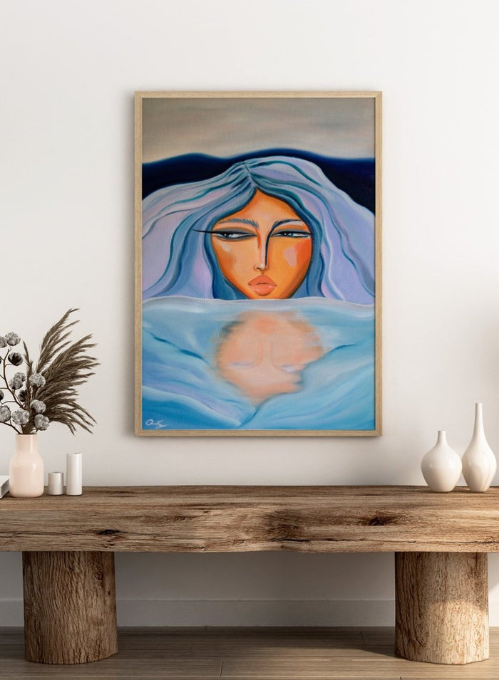Artistic depiction of a woman with blue hair and a serene expression, surrounded by water. Ethereal Woman's Reflection by Amy Straley is a contemporary figurative art print featuring a feminine portrait, water reflection, and soft blue tones.