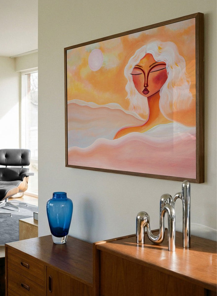 Framed abstract artwork with a woman's face and warm colors. Golden Hour Dreamer by Amy Straley is a contemporary figurative art print featuring warm sunset tones, a feminine portrait, and expressive modern artwork.