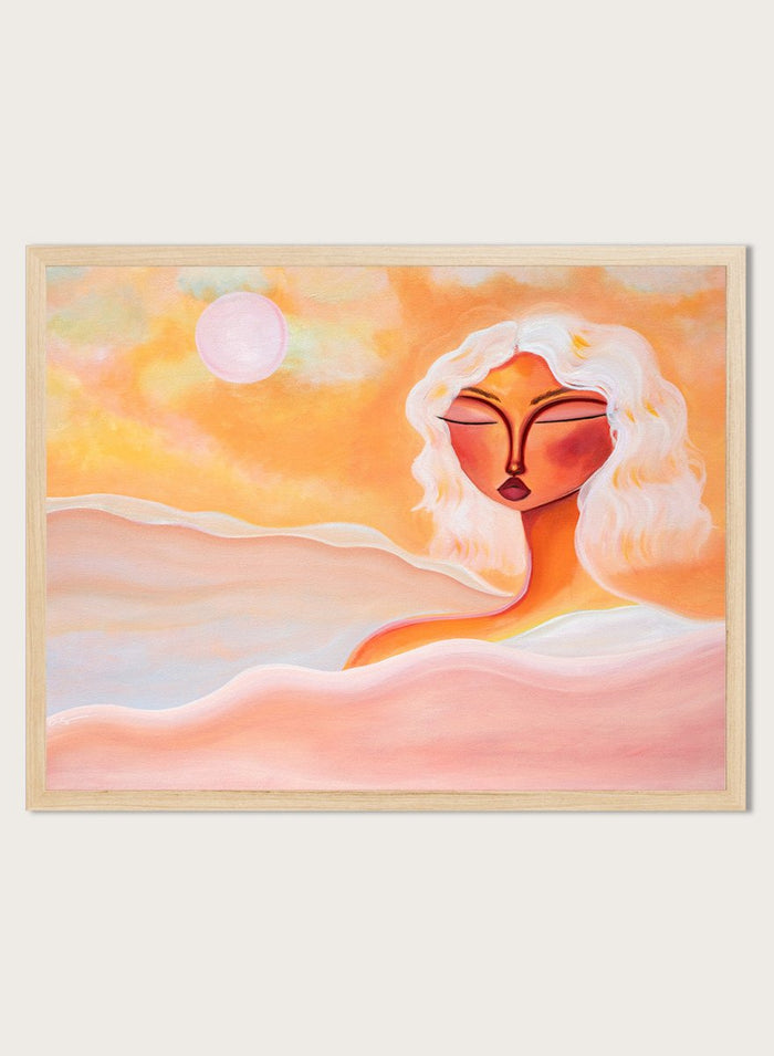 Framed abstract artwork with a woman's face and warm colors. Golden Hour Dreamer by Amy Straley is a contemporary figurative art print featuring warm sunset tones, a feminine portrait, and expressive modern artwork.
