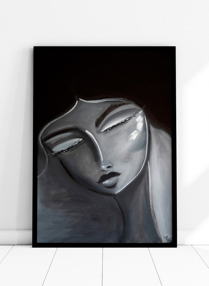 Artistic depiction of a stylized face with long hair on a dark background. Serene Woman Portrait by Amy Straley is a contemporary figurative art print featuring a monochromatic female portrait in soft grey and silver tones.