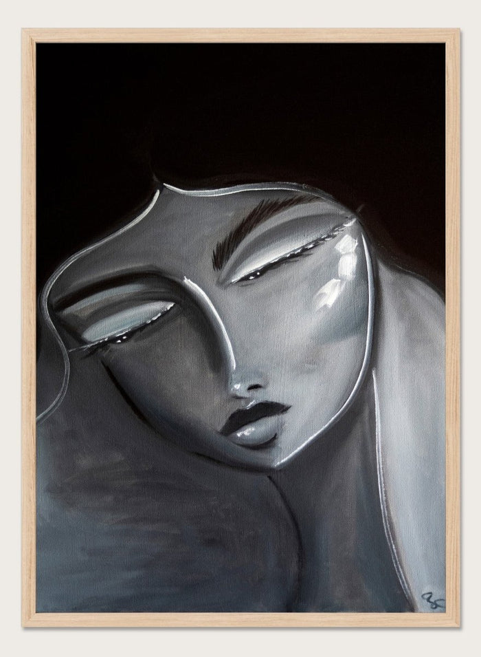 Artistic depiction of a stylized face with long hair on a dark background. Serene Woman Portrait by Amy Straley is a contemporary figurative art print featuring a monochromatic female portrait in soft grey and silver tones.