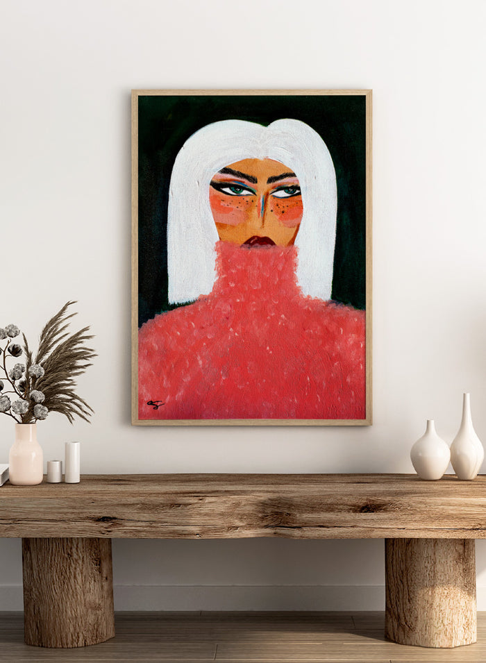 A stylized portrait painting of a woman with a white bob haircut, pale skin with orange-red blush and freckles, dark eyes, and a textured red turtleneck against a black background. Woman in Pink Turtleneck by Amy Straley, a contemporary figurative wall art print featuring a woman portrait, white hair, bold makeup, and vivid pink tones.