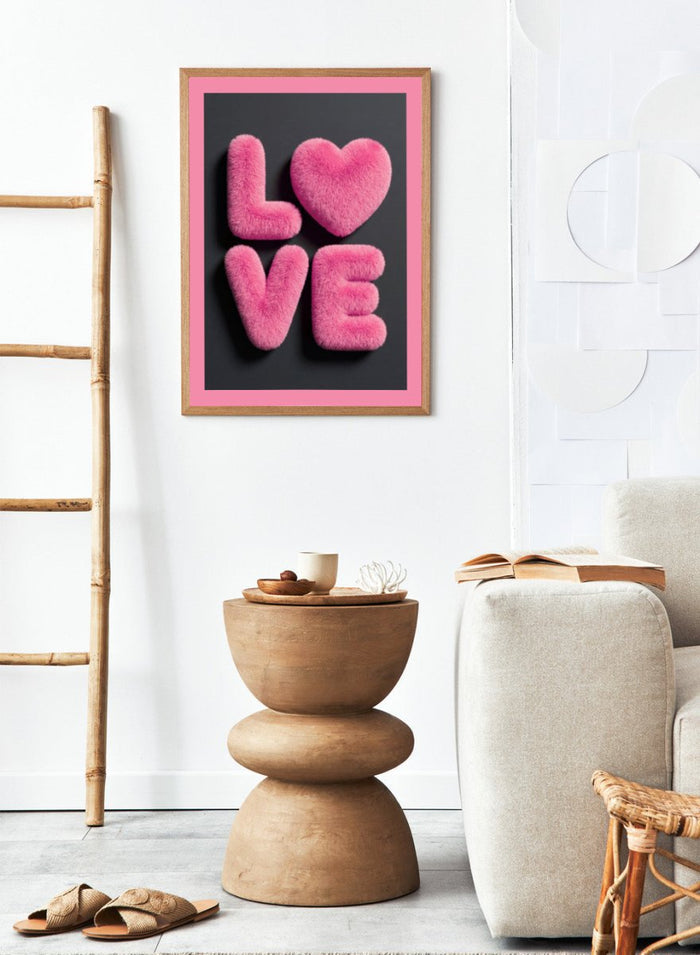 Pink fluffy letters spelling 'LOVE' on a black background with a pink border. Furry Love by Andreas Magnusson is a bold pink typography art print featuring playful textured lettering. A modern love-inspired wall poster.