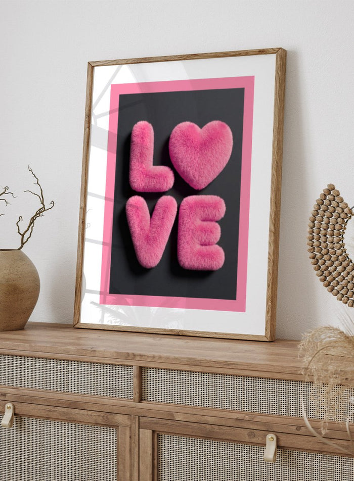 Pink fluffy letters spelling 'LOVE' on a black background with a pink border. Furry Love by Andreas Magnusson is a bold pink typography art print featuring playful textured lettering. A modern love-inspired wall poster.