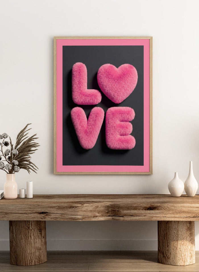 Pink fluffy letters spelling 'LOVE' on a black background with a pink border. Furry Love by Andreas Magnusson is a bold pink typography art print featuring playful textured lettering. A modern love-inspired wall poster.