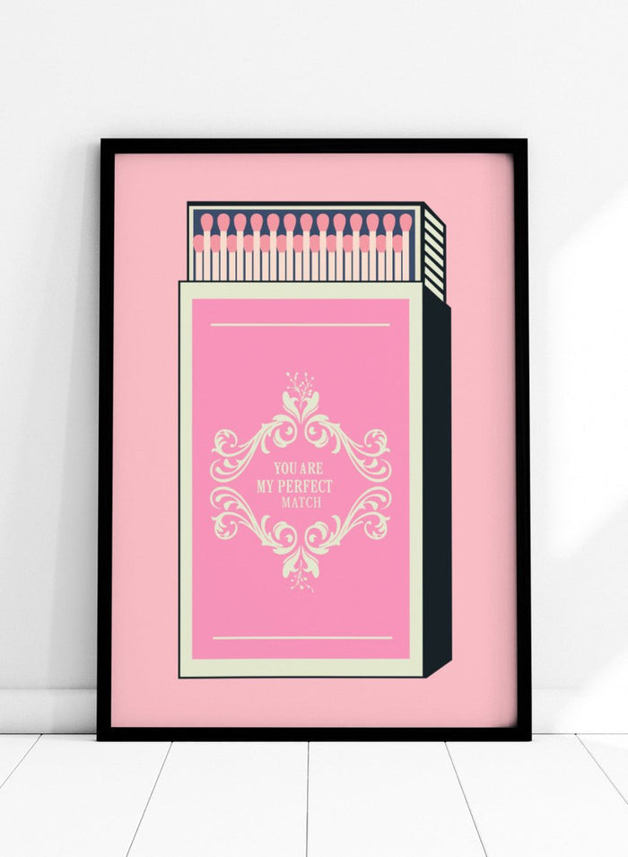 Matchbox with decorative design and text on a pink background. My Perfect Match by Andreas Magnusson is an officially licensed art print featuring a pink matchbox and playful typography. Modern graphic love poster.