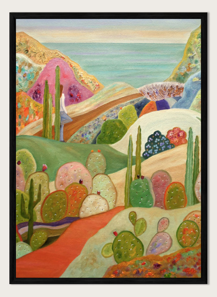 A colorful landscape painting featuring stylized cacti and succulents in a desert valley, with rolling hills, a pink mountain, and a blue sea or sky in the background. Shop Colorful Desert Yoga View by Angeles M. Pomata, a colorful desert landscape art print featuring cacti, rolling hills, a yoga figure, and coastal views.