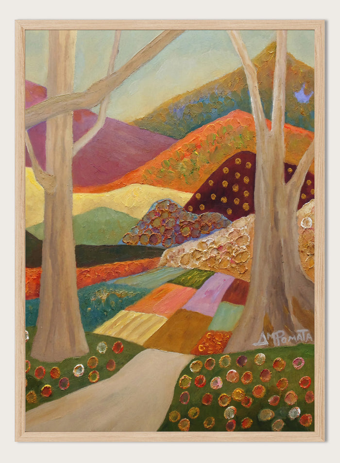 A colorful landscape painting featuring stylized trees, a winding path, patchwork fields, and rolling hills in warm and cool tones, with a visible artist signature in the lower right. Shop Colorful Field Path by Angeles M. Pomata, an autumn landscape art print featuring a winding path, textured fields, flowers, and rolling countryside.
