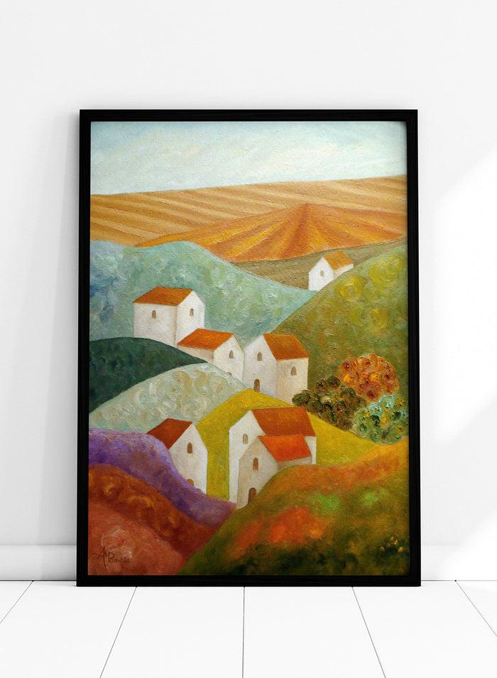 A colorful landscape painting featuring white houses with orange-red roofs nestled among rolling hills in shades of green, purple, yellow, and orange, with a plowed field under a pale sky in the background. Shop Colorful Hillside Village by Angeles M. Pomata, an autumn countryside art print featuring white houses, rolling hills, warm fields, and earthy color.