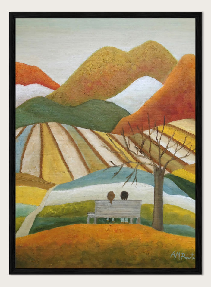 A stylized landscape painting with layered mountains, terraced fields, a bare tree, and two small figures seated on a bench in the foreground. Shop Couple On Autumn Bench by Angeles M. Pomata, an autumn landscape and figurative art print featuring a seated couple, rolling hills, patchwork fields, and warm fall tones.