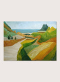A framed landscape painting featuring a winding cream-colored path through green and ochre hills, leading to a blue sea and distant mountain under a pale sky. Shop Vibrant Coastal Vista by Angeles M. Pomata, a colorful coastal landscape art print featuring winding roads, rolling fields, rugged hills, and blue sea views.