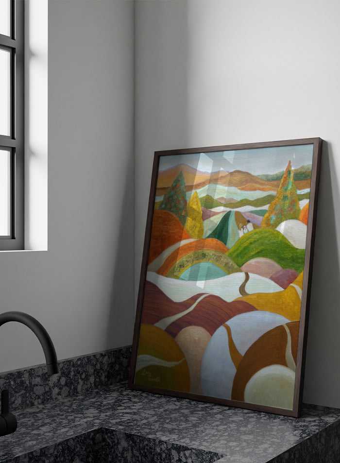 An abstract landscape painting featuring rolling hills, stylized trees, and distant mountains in a warm palette of orange, green, yellow, brown, and white. Shop Vibrant Hillside Path by Angeles M. Pomata, an autumn landscape art print with winding paths, rolling hills, and warm earthy tones.