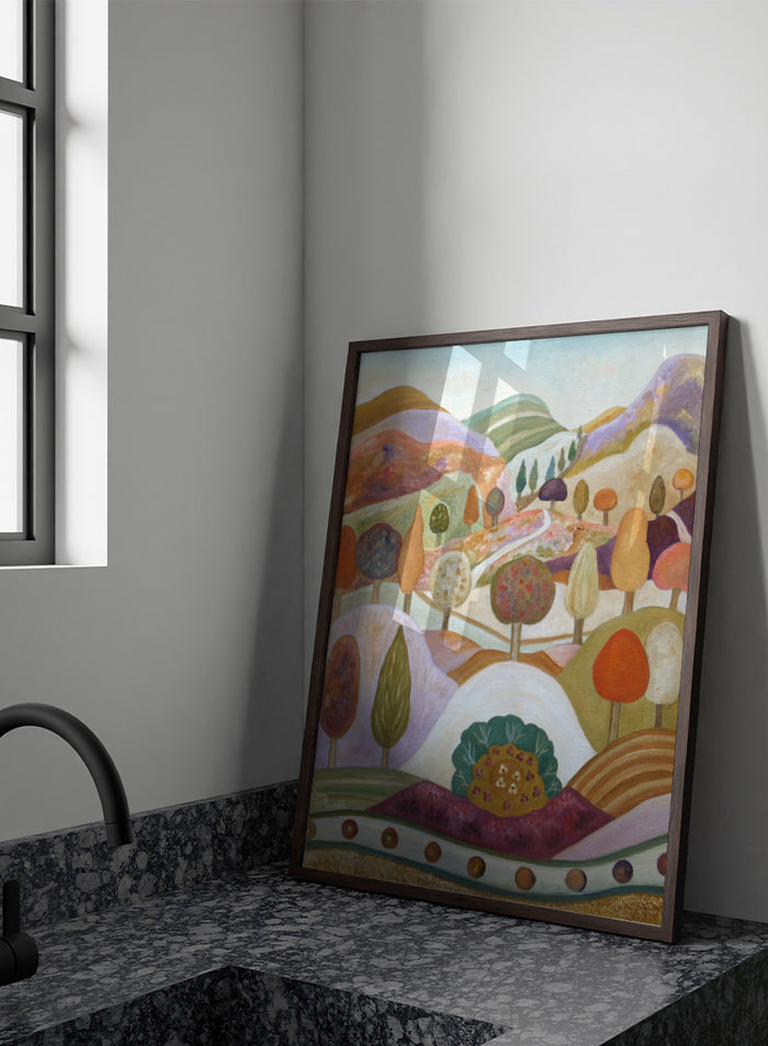 A colorful landscape painting featuring stylized hills, rolling hills, and trees in pastel and earthy tones. Shop Whimsical Autumn Landscape by Angeles M. Pomata, a colorful fall landscape art print featuring rolling hills, winding paths, and stylized autumn trees.