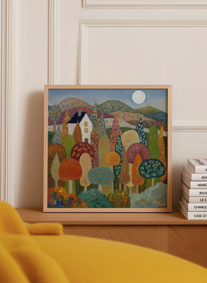 A framed folk-art style landscape painting featuring stylized mushrooms, trees, hills, a small house, and a full moon. Shop Whimsical Moonlit Landscape by Angeles M. Pomata, a colorful autumn landscape art print featuring a white house, full moon, rolling hills, and stylized trees.