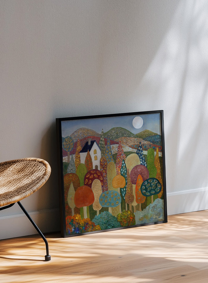 A framed folk-art style landscape painting featuring stylized mushrooms, trees, hills, a small house, and a full moon. Shop Whimsical Moonlit Landscape by Angeles M. Pomata, a colorful autumn landscape art print featuring a white house, full moon, rolling hills, and stylized trees.
