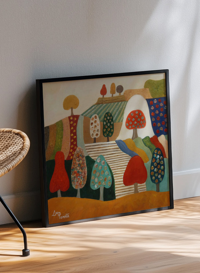 A framed abstract landscape painting featuring stylized trees, hills, and geometric shapes in red, blue, green, yellow, beige, and brown tones. Shop Whimsical Tree Landscape by Angeles M. Pomata, a colorful landscape art print featuring patterned trees, patchwork hills, and warm autumn tones.