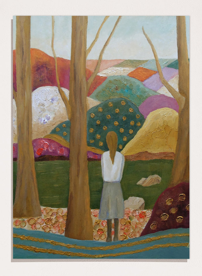 An expressive painting of a woman seen from behind standing among tall trees in a stylized landscape with colorful hills, patches of green, purple, pink, blue, and gold accents. Shop Woman Among Vibrant Hills by Angeles M. Pomata, a colorful landscape and portrait art print featuring a woman, rolling hills, trees, and earthy tones.