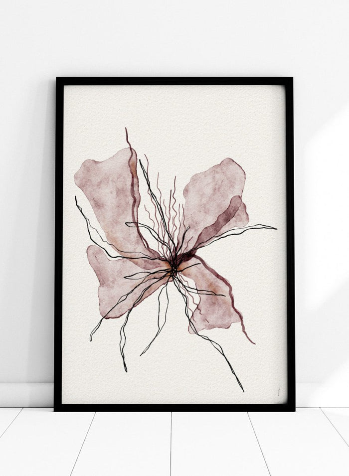 Framed artwork of a pink flower on a white wall. Booming Blooming by Ankie Kooi features an abstract flower illustration with soft watercolor petals and fine line details. Minimal botanical art print inspired by nature and growth.