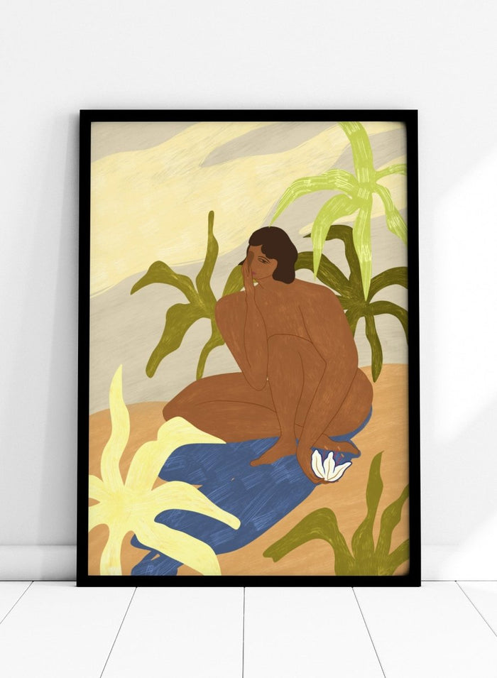 An art print featuring a stylized illustration of a seated figure with dark hair, surrounded by green tropical leaves, a blue cloth, and a white flower, set against a sandy beige and cream background. Au Naturel by Arty Guava premium framed fine art print featuring a seated woman surrounded by oversized tropical plants in warm earthy tones.