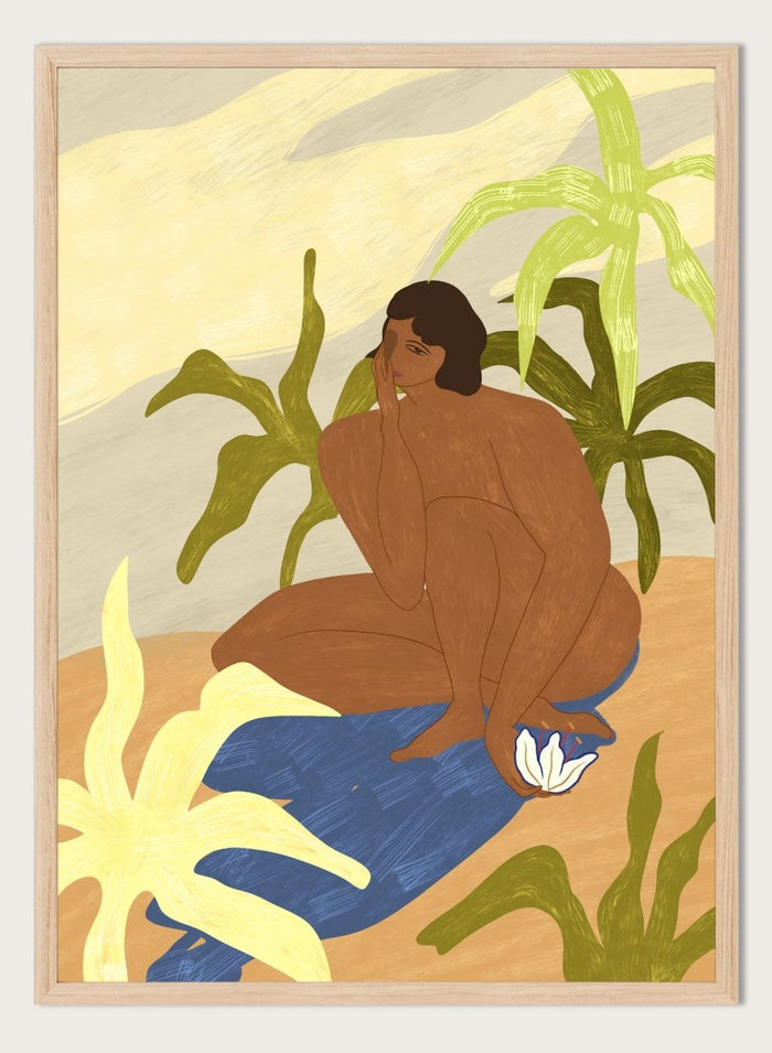 An art print featuring a stylized illustration of a seated figure with dark hair, surrounded by green tropical leaves, a blue cloth, and a white flower, set against a sandy beige and cream background. Au Naturel by Arty Guava premium framed fine art print featuring a seated woman surrounded by oversized tropical plants in warm earthy tones.