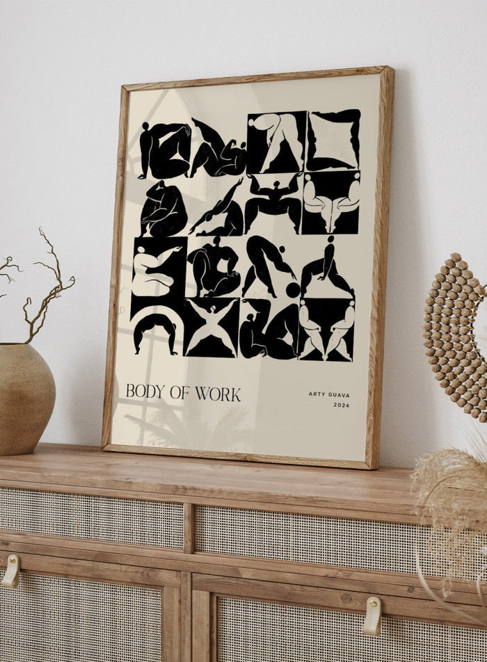 Artistic poster with black silhouettes of people on a beige background, featuring the text 'Body of Work' and 'Arty Guava 2024'. Body of Work (Forest) by Arty Guava is a modern figure art print with green silhouettes in motion. Officially licensed wall poster with framing.