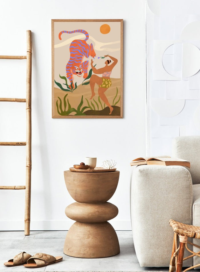 Illustration of a tiger and a person in a natural setting with plants and a sun. Dance with Me by Arty Guava is a colorful contemporary art print featuring a dancing woman, playful tiger, tropical motifs, and whimsical modern illustration.