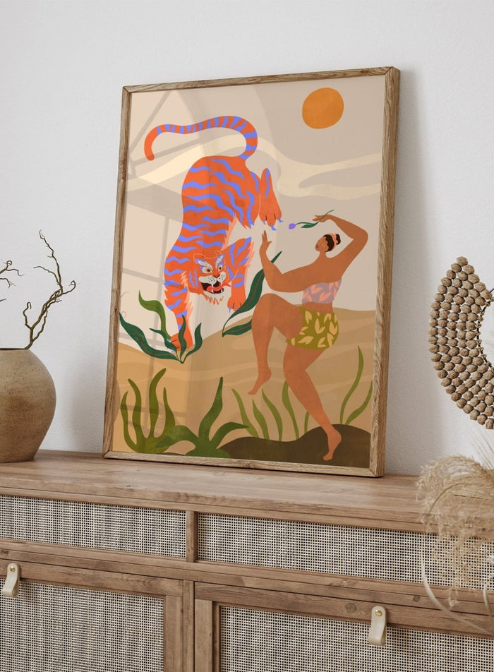 Illustration of a tiger and a person in a natural setting with plants and a sun. Dance with Me by Arty Guava is a colorful contemporary art print featuring a dancing woman, playful tiger, tropical motifs, and whimsical modern illustration.
