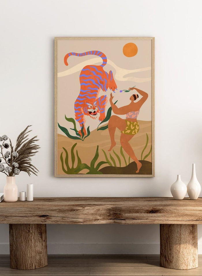 Illustration of a tiger and a person in a natural setting with plants and a sun. Dance with Me by Arty Guava is a colorful contemporary art print featuring a dancing woman, playful tiger, tropical motifs, and whimsical modern illustration.