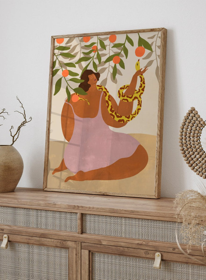 Illustration of a woman holding a snake with oranges and leaves in the background. Eden’s Embrace by Arty Guava art print featuring woman with snake under orange tree branches, tropical nature illustration, and vibrant contemporary wall art poster.
