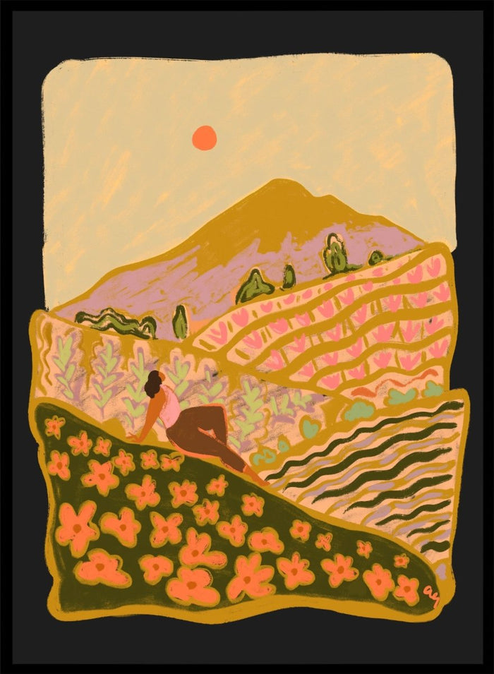 Illustration of a person sitting on a hill with a mountain and sunset in the background. Field Of Flowers by Arty Guava is a colorful landscape art print featuring blooming fields, rolling hills, nature-inspired illustration, and contemporary wall art.