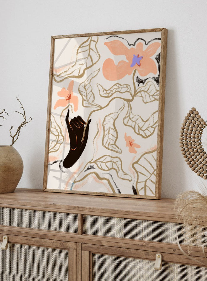 Abstract artwork with a black hand reaching towards flowers on a light background. Fleur by Arty Guava is a modern floral art print with soft abstract flowers and hand-drawn linework. Officially licensed wall poster with framing.