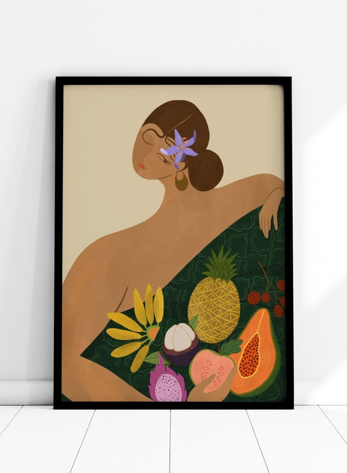 Illustration of a woman with a green wrap featuring tropical fruits on a beige background. Fruit Seller by Arty Guava is a colorful tropical art print featuring exotic fruit, expressive female figures, bold color, and contemporary illustration.