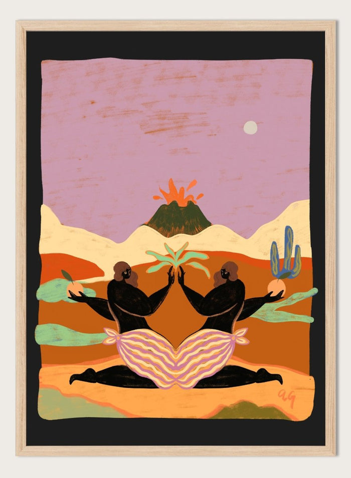 A framed art print featuring a stylized desert landscape with two black silhouetted figures seated in a lotus position, facing each other beneath a volcano and cacti, set against a pink sky. Lava by Arty Guava premium framed fine art print featuring mirrored women, tropical plants, and a glowing volcano in bold, surreal colors.