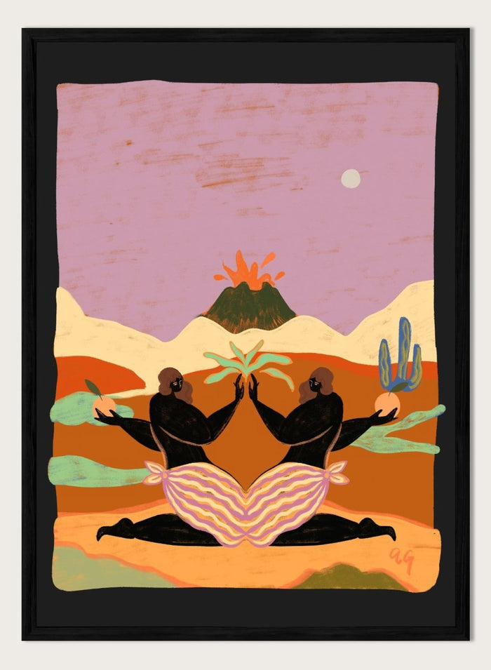 A framed art print featuring a stylized desert landscape with two black silhouetted figures seated in a lotus position, facing each other beneath a volcano and cacti, set against a pink sky. Lava by Arty Guava premium framed fine art print featuring mirrored women, tropical plants, and a glowing volcano in bold, surreal colors.