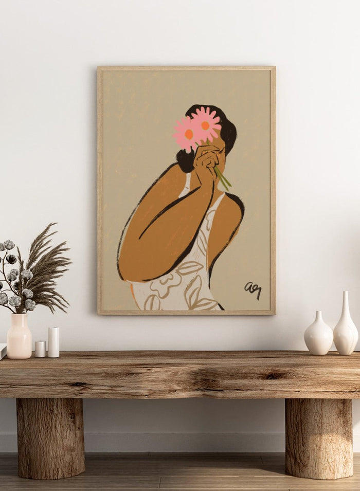 Illustration of a person holding a pink flower to their face against a beige background. Mask by Arty Guava art print, modern woman illustration holding flowers, contemporary figurative wall poster in soft neutral tones.