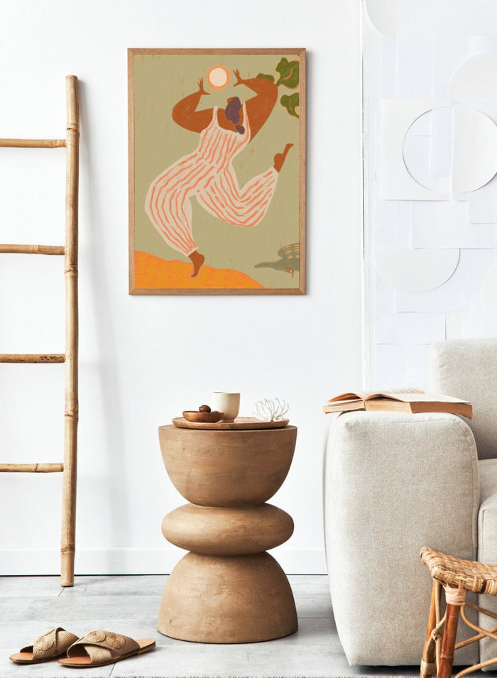 Artistic depiction of a person in overalls reaching towards the sun on a beige background. Reach For The Sun by Arty Guava is a vibrant modern art print of a woman stretching toward the sun. Officially licensed wall poster with framing.
