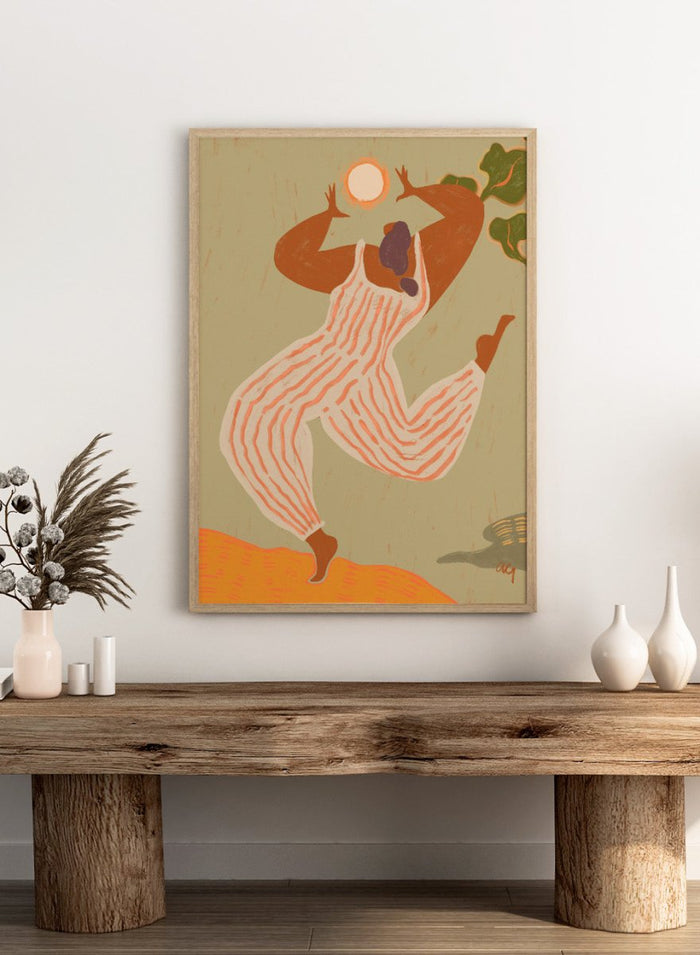 Artistic depiction of a person in overalls reaching towards the sun on a beige background. Reach For The Sun by Arty Guava is a vibrant modern art print of a woman stretching toward the sun. Officially licensed wall poster with framing.