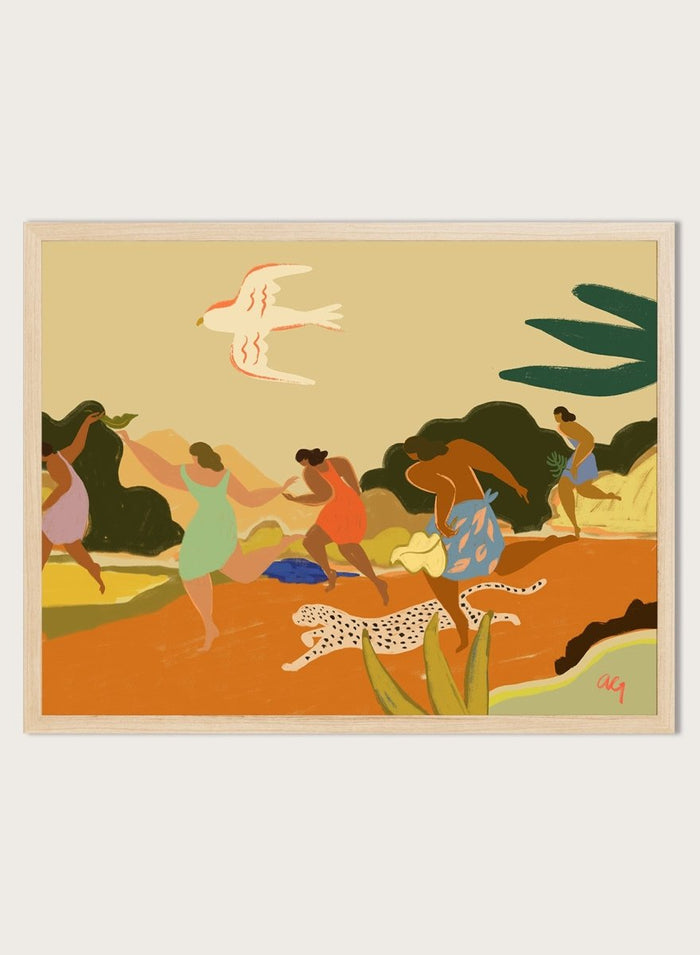 A framed art print featuring a stylized illustration of figures dancing and playing outdoors, with a bird, palm leaves, and a spotted cat. Run by Arty Guava premium framed fine art print featuring women racing through a tropical landscape beside a spotted leopard in warm, playful colors.