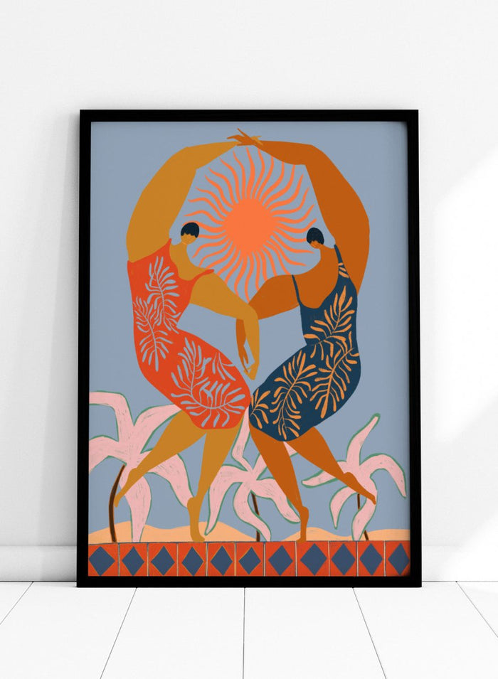 Artistic depiction of two dancers with a sun in the center on a blue background. Sisterhood by Arty Guava is a modern art print of two women dancing under the sun, celebrating friendship and unity. Officially licensed wall poster.