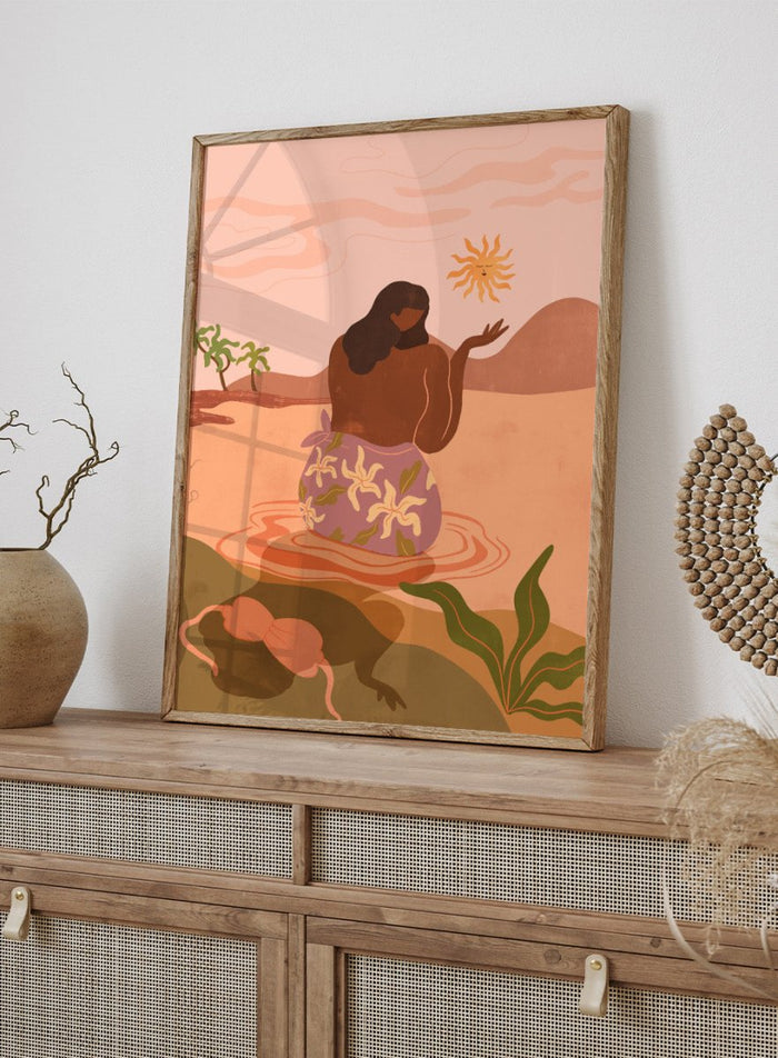 Illustration of a woman in a floral dress sitting by a pool with a sun and desert landscape in the background. Sunset by Arty Guava art print, modern woman illustration wall poster in warm pink tones, contemporary nature landscape artwork.