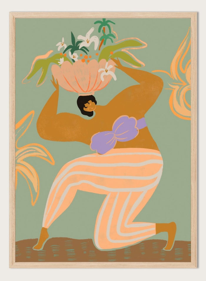 A stylized art print featuring a woman in flowing peach and white striped pants with a purple sash, carrying a large flower basket on her head against a muted sage green background. The Weight of the World by Arty Guava premium framed fine art print featuring a woman carrying tropical flowers in soft green, peach, and lilac tones.