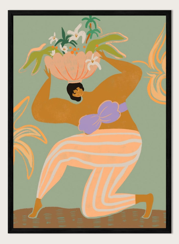 A stylized art print featuring a woman in flowing peach and white striped pants with a purple sash, carrying a large flower basket on her head against a muted sage green background. The Weight of the World by Arty Guava premium framed fine art print featuring a woman carrying tropical flowers in soft green, peach, and lilac tones.