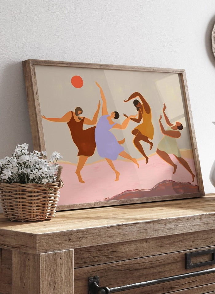 Together by Arty Guava premium framed fine art print featuring four women dancing beneath a coral sun across a soft pink landscape in warm, playful colors.
