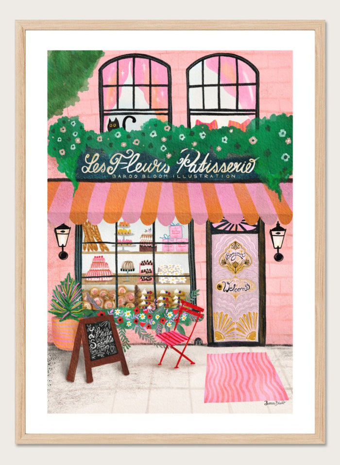 Illustration of a bakery named 'Les Fleuris Patisserie' with a pink exterior and greenery. Bake Shop Front by Baroo Bloom art print featuring a colorful bakery storefront illustration. Whimsical European street scene wall poster with pink tones and playful detail.