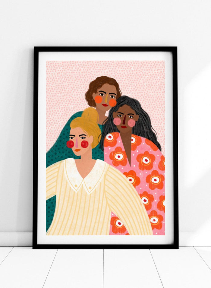 Illustration of three women with colorful clothing and patterns on a pink background. Girl Friends by Bea Müller is an officially licensed art print featuring three women illustrated in her signature bold colors and modern expressive style.