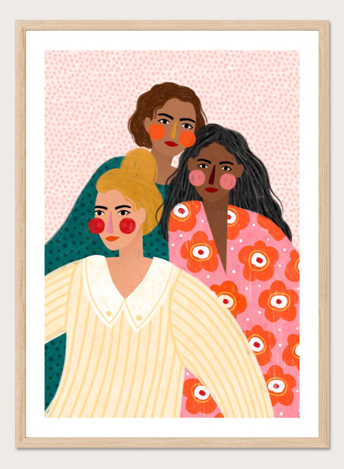 Illustration of three women with colorful clothing and patterns on a pink background. Girl Friends by Bea Müller is an officially licensed art print featuring three women illustrated in her signature bold colors and modern expressive style.
